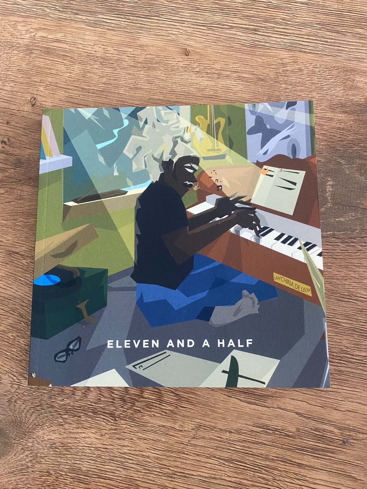 A square book with an animation of a black man playing the piano.