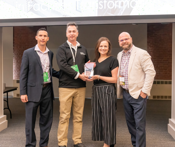 Kurt Yeghian, Founder and CEO (left-middle), and Holly Vaillancourt, Operations Director (right-middle) accepting the Excellence in Transformation Award at FMForward from a successful partnership on the Worcester Art Museum project