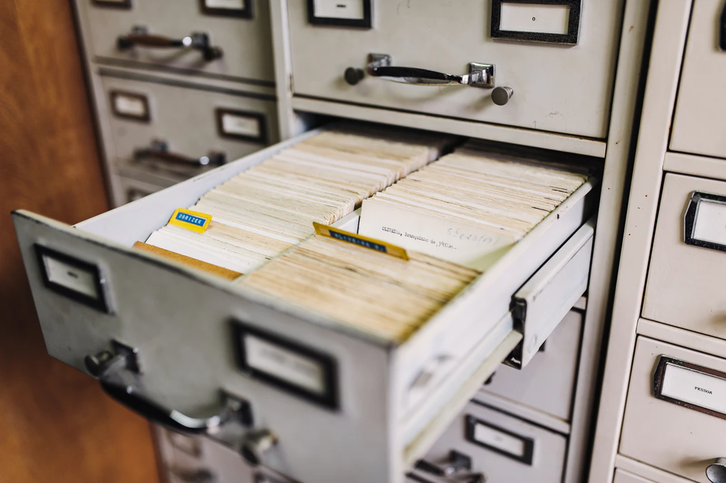 a filing cabinet filled with paper files