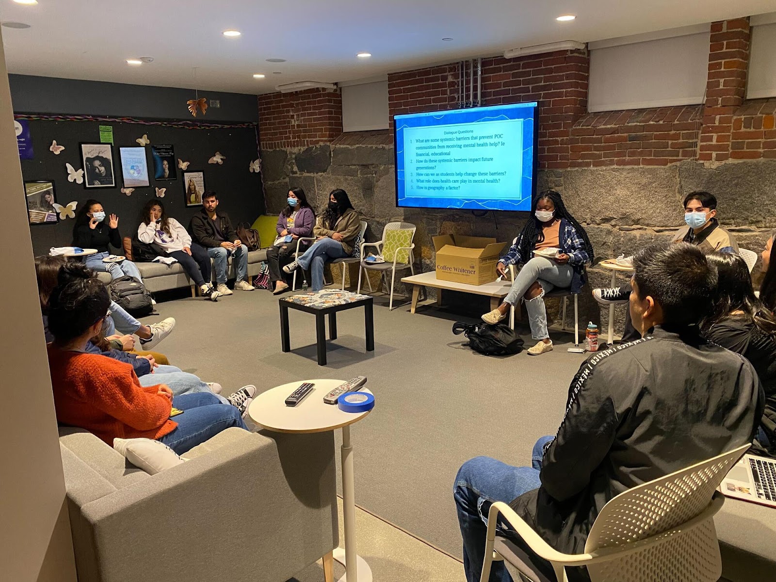 Students sit in Grays Hall lounge in a circle engaged in discussion during a diversity dialogue. 