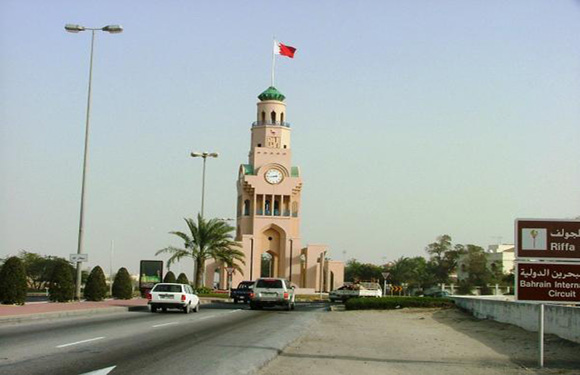 The Riffa Cloth Tower, topped with the flag of Bahrain.