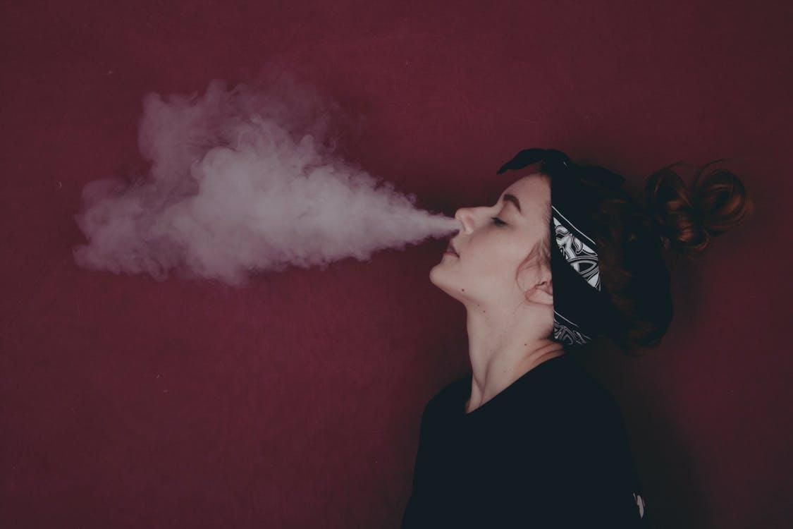 Free Woman in Black Shirt Smoking Stock Photo