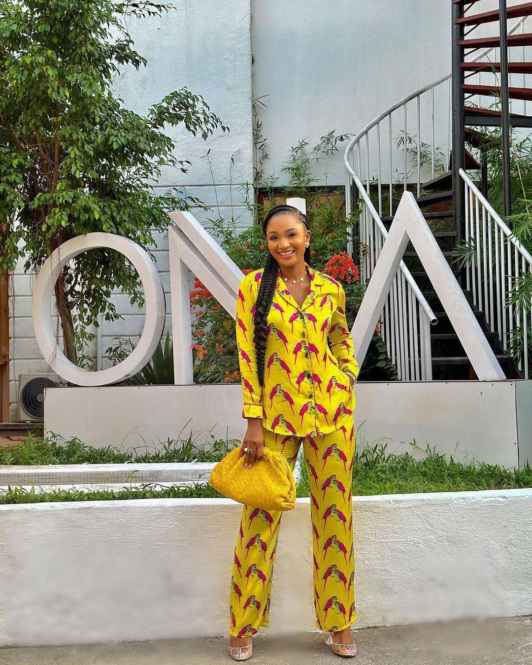 smiling lady rocking two-piece ankara outfit