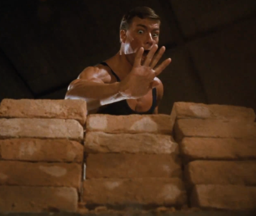 Jean Van Claude Damme as Frank Dux demonstrates DIM MAK technique in Bloodsport (1985) / Warner Bros