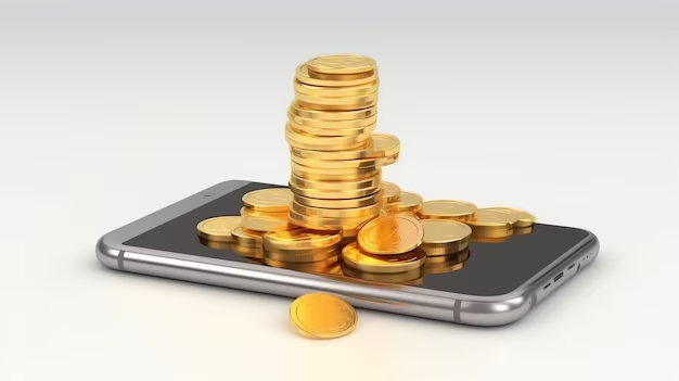 A smartphone with a stack of gold coins on top