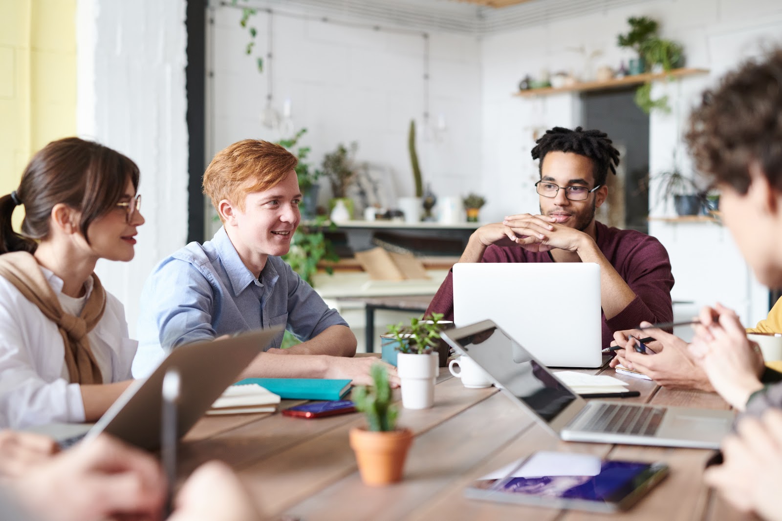  A business meeting where team members are figuring out how to streamline their work duties.