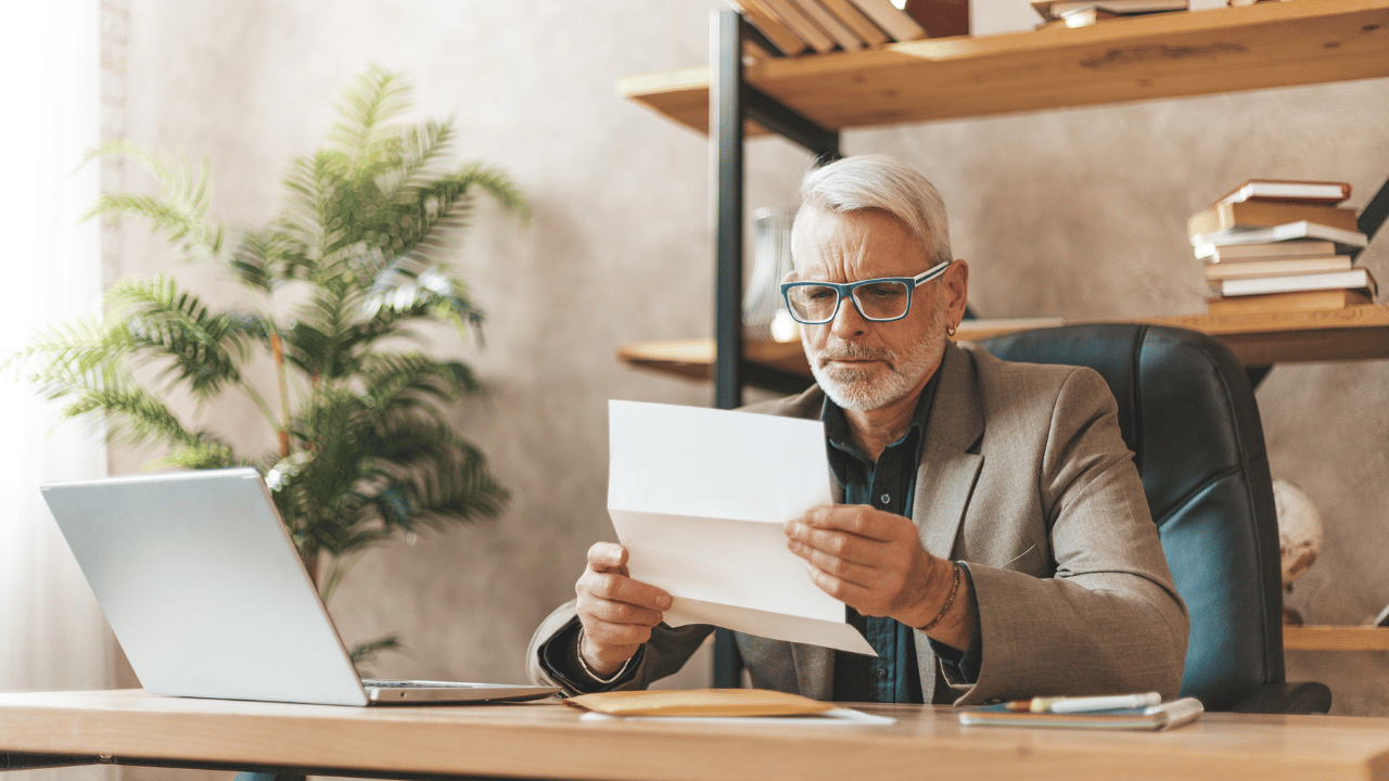 A man looking at an annuity contract from an insurance company