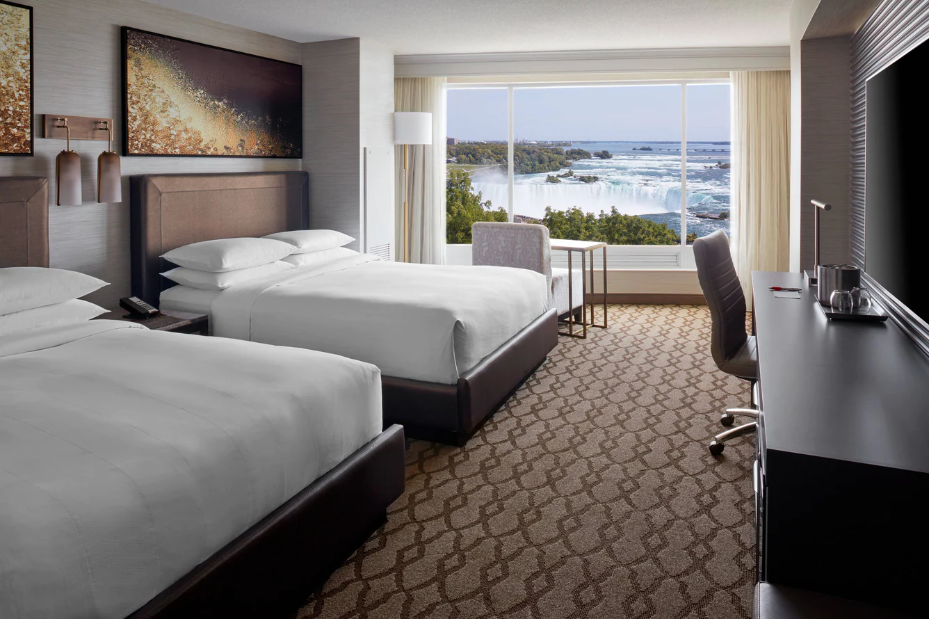 A hotel room overviewing the Niagara Falls.
