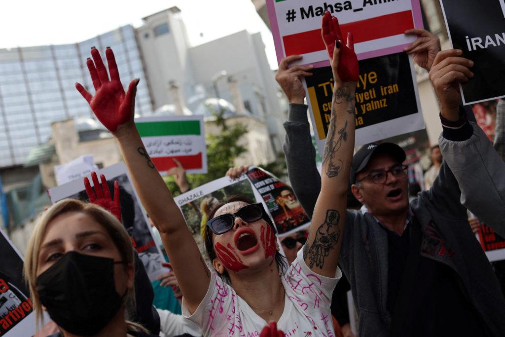 Demonstrators shout slogans during a protest against the Iranian regime, in Istanbul