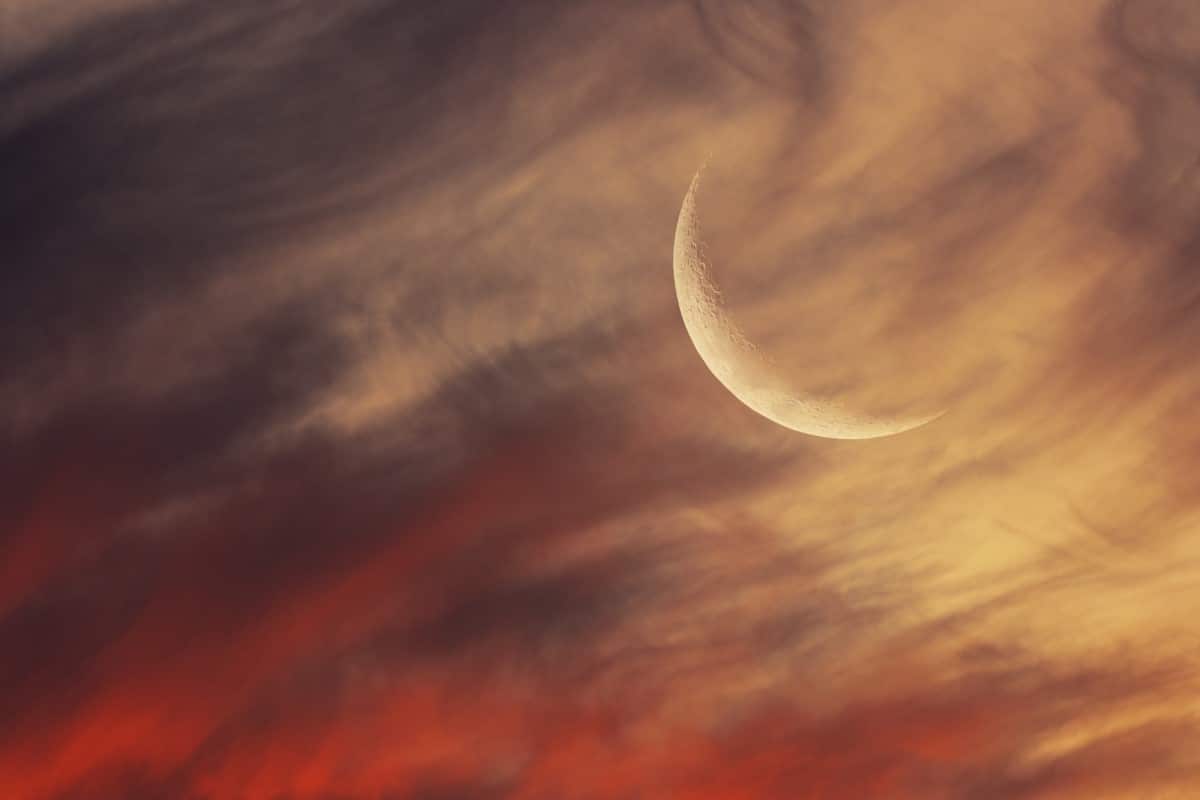 Crescent Moon with Red Clouds in Argentina
