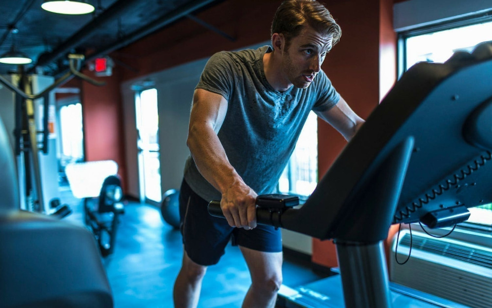 Holding onto the treadmill isn't safe