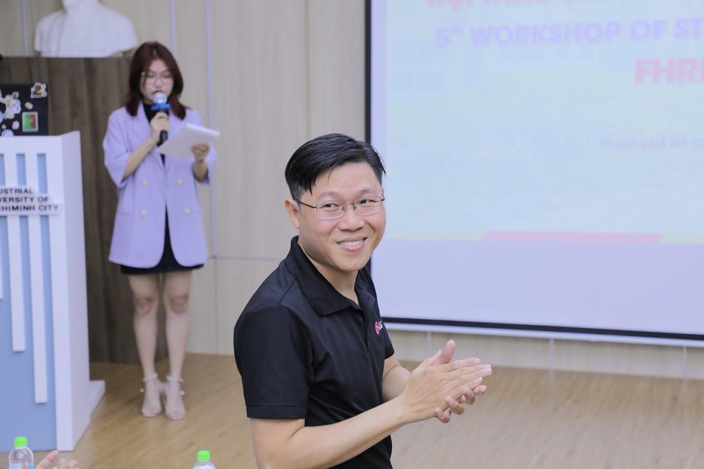 A person in a black shirt clappingDescription automatically generated with low confidence