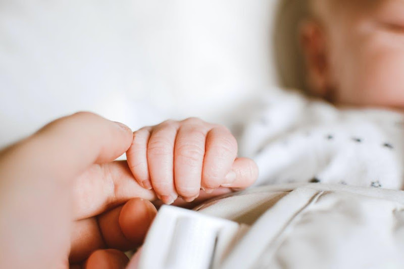 Free Person Holding Baby's Hand Stock Photo