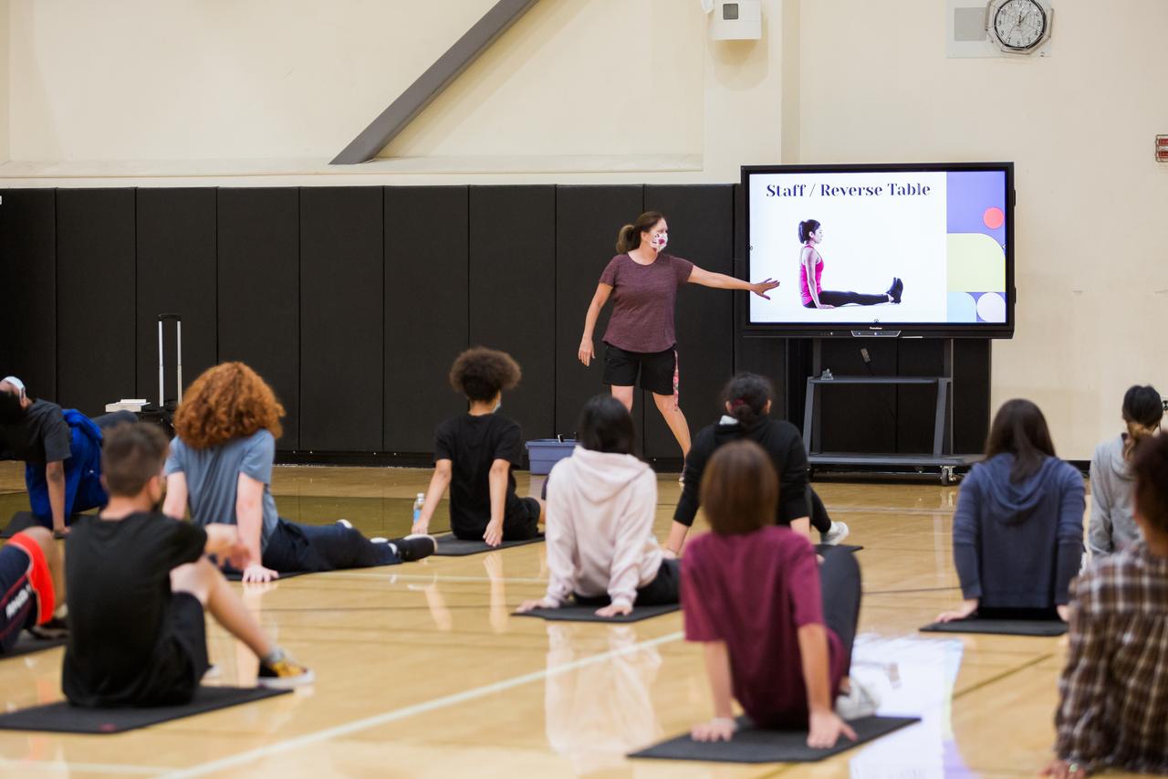 students doing yoga in a physical education class