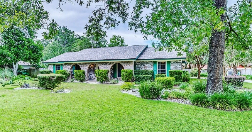 A single-family home, complete with ornate brick columns on the front porch, found in the Orange Park area of Jacksonville, Florida.