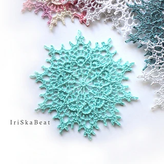 beautiful lacy crochet thread snowflakes on white background