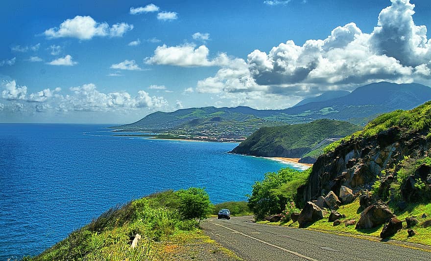 St.Kitts ocean road view with the sea and rolling hills 