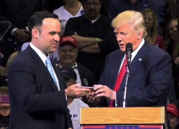 Dan Scavino Jr. appears with Donald Trump at a presidential campaign rally in this undated Facebook photo.