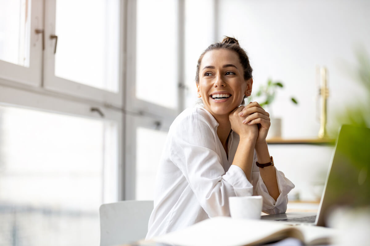 Happy woman sitting on a chair