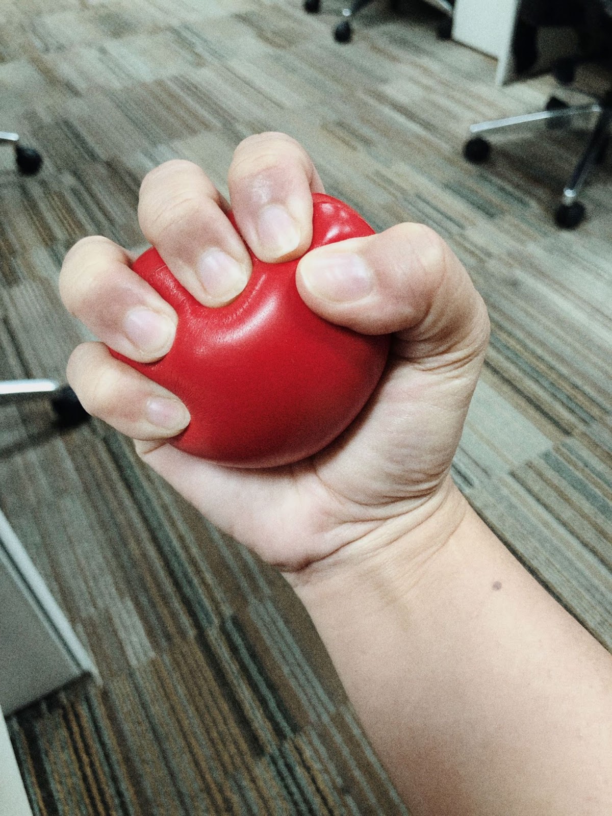 hand-squeezing-red-stress-ball