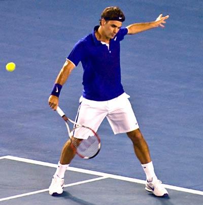 Federer hitting a slice.