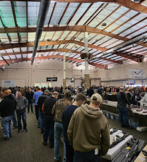 Eagle Shows Gun Show attendees browsing vendor tables