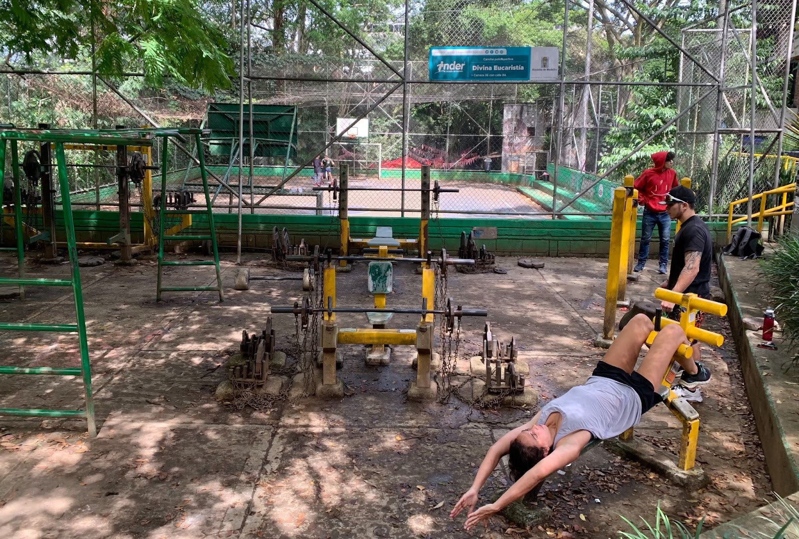 People exercising in a open air gym