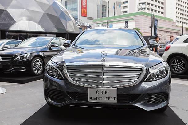 Mercedes-Benz C 300 Bangkok, Thailand - September 26, 2015: Mercedes-Benz C 300 BlueTEC HYBRID presented on Mercedes-Benz Star Dome display at Central World. mercedes benz c 300 stock pictures, royalty-free photos & images