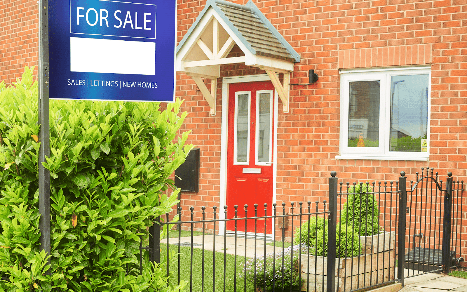 A sign in front of a brick building

Description automatically generated with low confidence