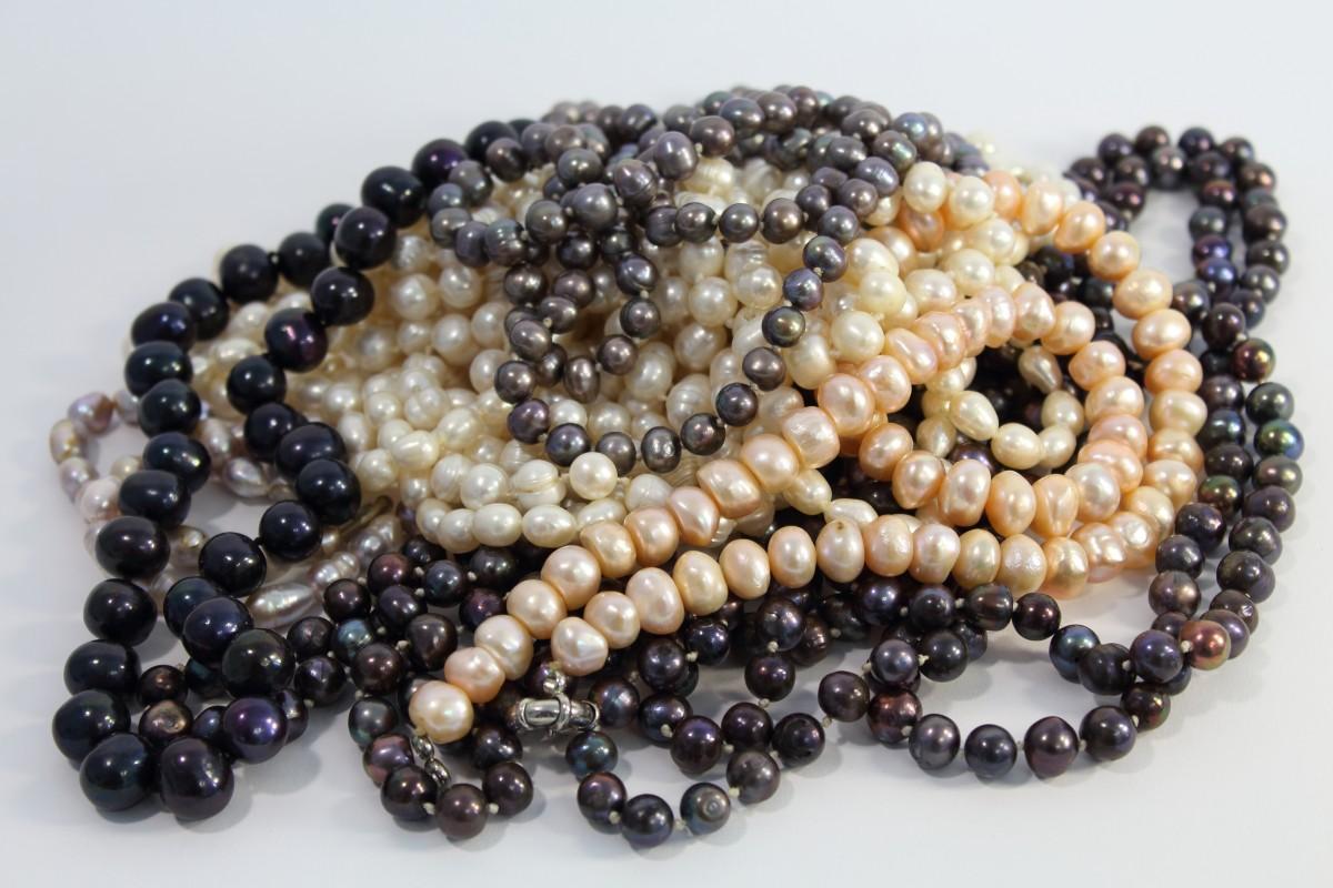 Beads in pink, white, black, lead, and gray