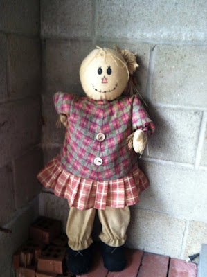 Scarecrow doll bricks cinder block wall photo Scarecrow doll bricks cinder block wall photo