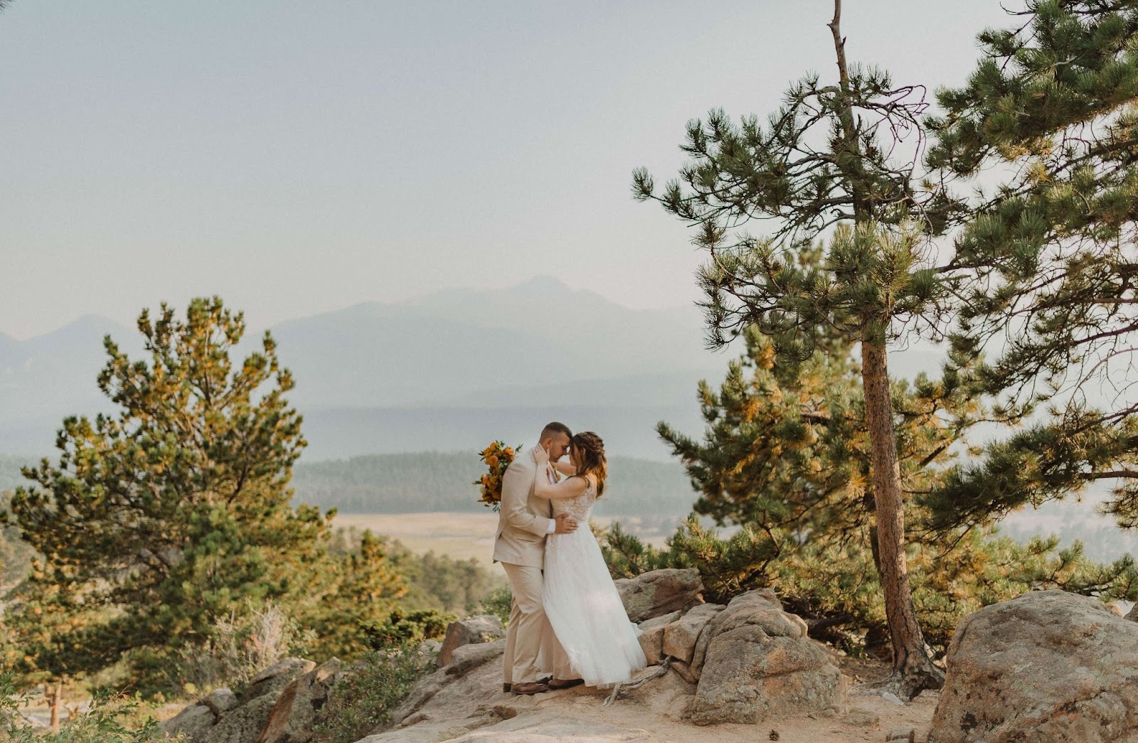 couple hugging at elopement ceremony in Rocky Mountain National Park