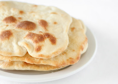 close-up photo of three pieces of naan