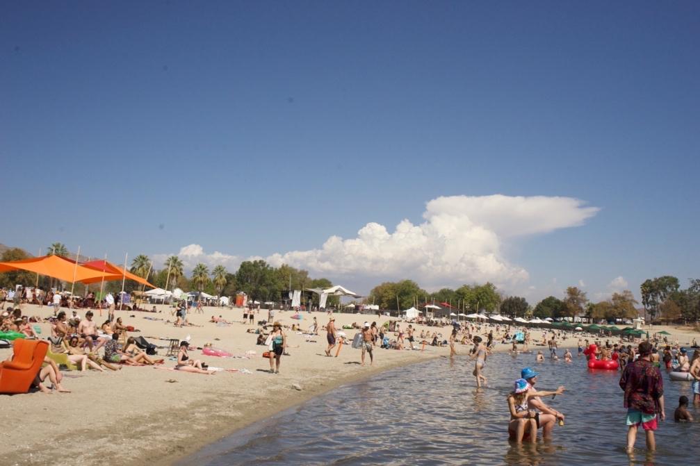 A crowded beach with people

Description automatically generated with low confidence