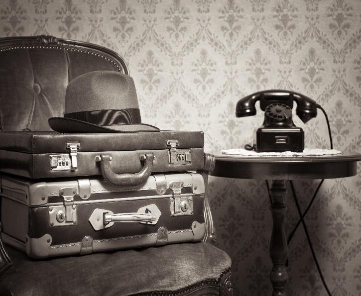 A picture containing indoor, black and white, suitcase, rotary phone on table
From Deposit Photos DP_55010401_XL

Description automatically generated