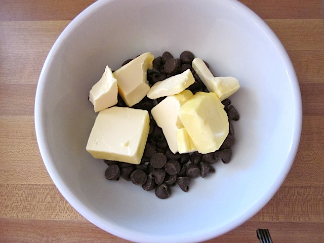 butter and chocolate chips in white bowl 