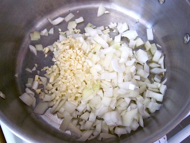diced onions and garlic in pot
