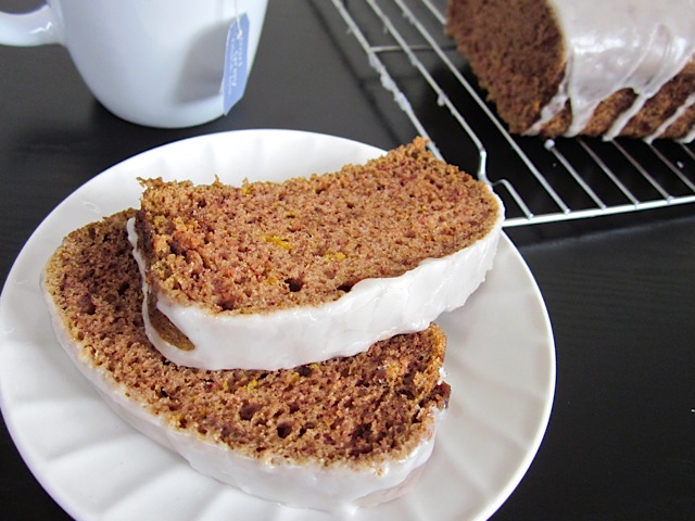 Two slices of lemon spice cake on a white plate 