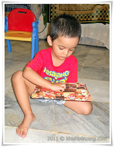 Pasha unwrapping his present
