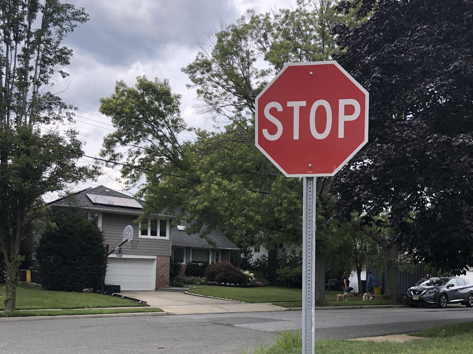 An automobile stopped in front of a sign might obscure it from oncoming traffic. Further, if vehicle owners disregard a sign and refuse to come to a complete stop, lives could be in danger.
