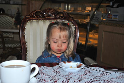 Arabella in Michi's Strudel Cafe This is a photo of Arabella in Michi's Strudel Cafe sitting in an upholstered armchair.