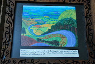 David Hockney Painting Info This is a photo of the painting referenced by the floral sculpture inside the Conservatory of the Bellagio Hotel and Casino, Las Vegas, NV.