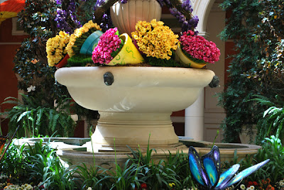 Bellagio Garden Area This is a photo of large planters with flowers tucked into a large fountain basin at the Bellagio Hotel and Casino, Las Vegas, NV.
