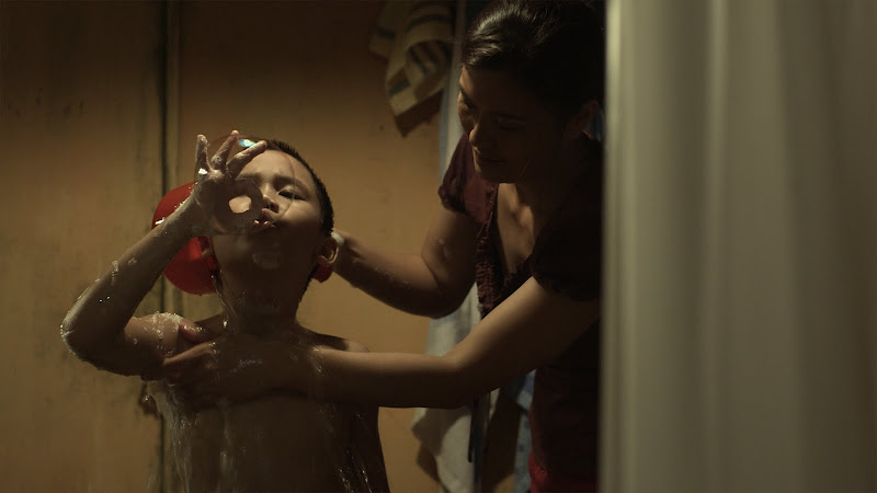 Bi (Thanh Minh Phan) blows bubbles in Phan Dang Di's drama BI, DON'T BE AFRAID