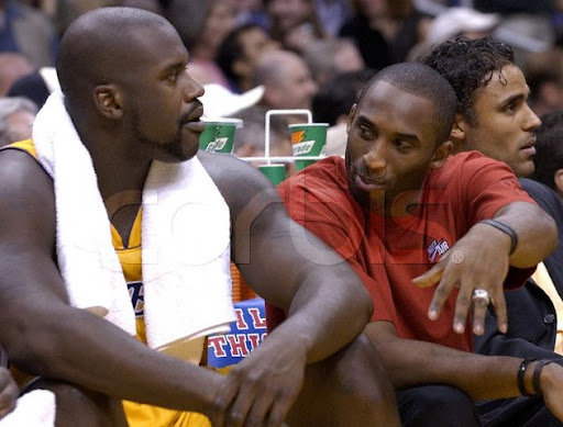 kobe bryant kisses teammate. Bryant was fined Tuesday by