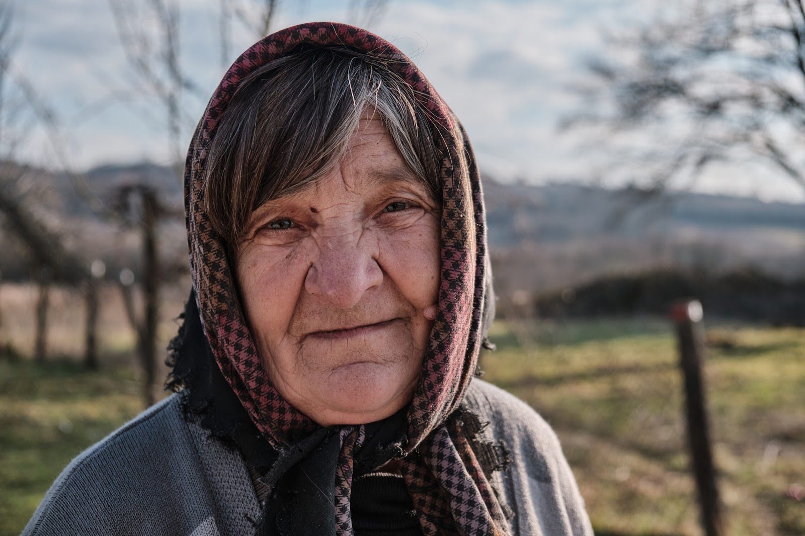 Mara, poses for a portrait in her village near the border with Croatia. | Photo: Chiara Fabbro
