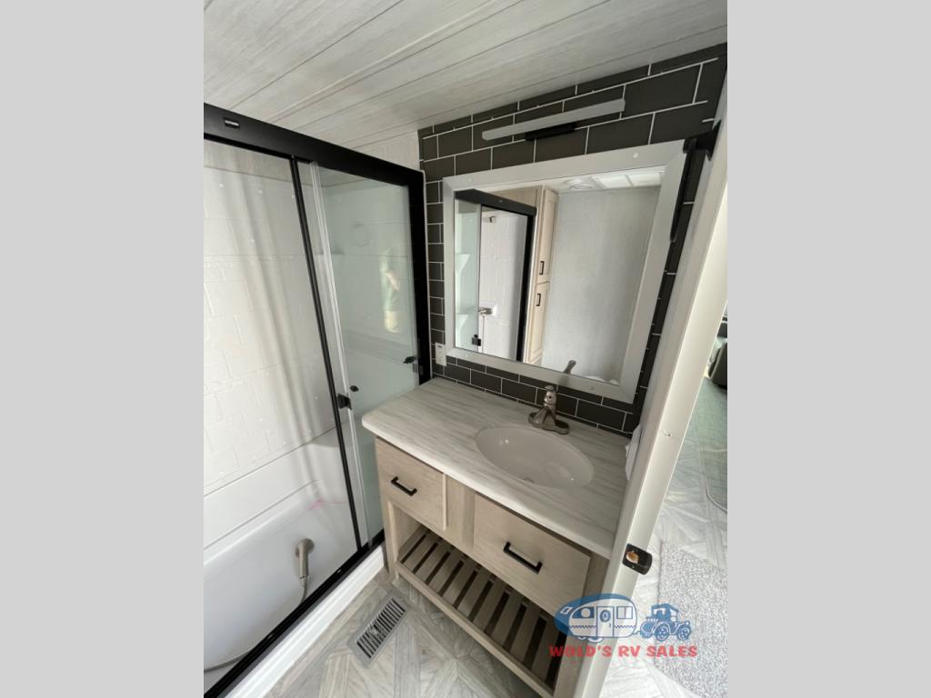 The massive counter and sink provides a great place to get ready for the day.