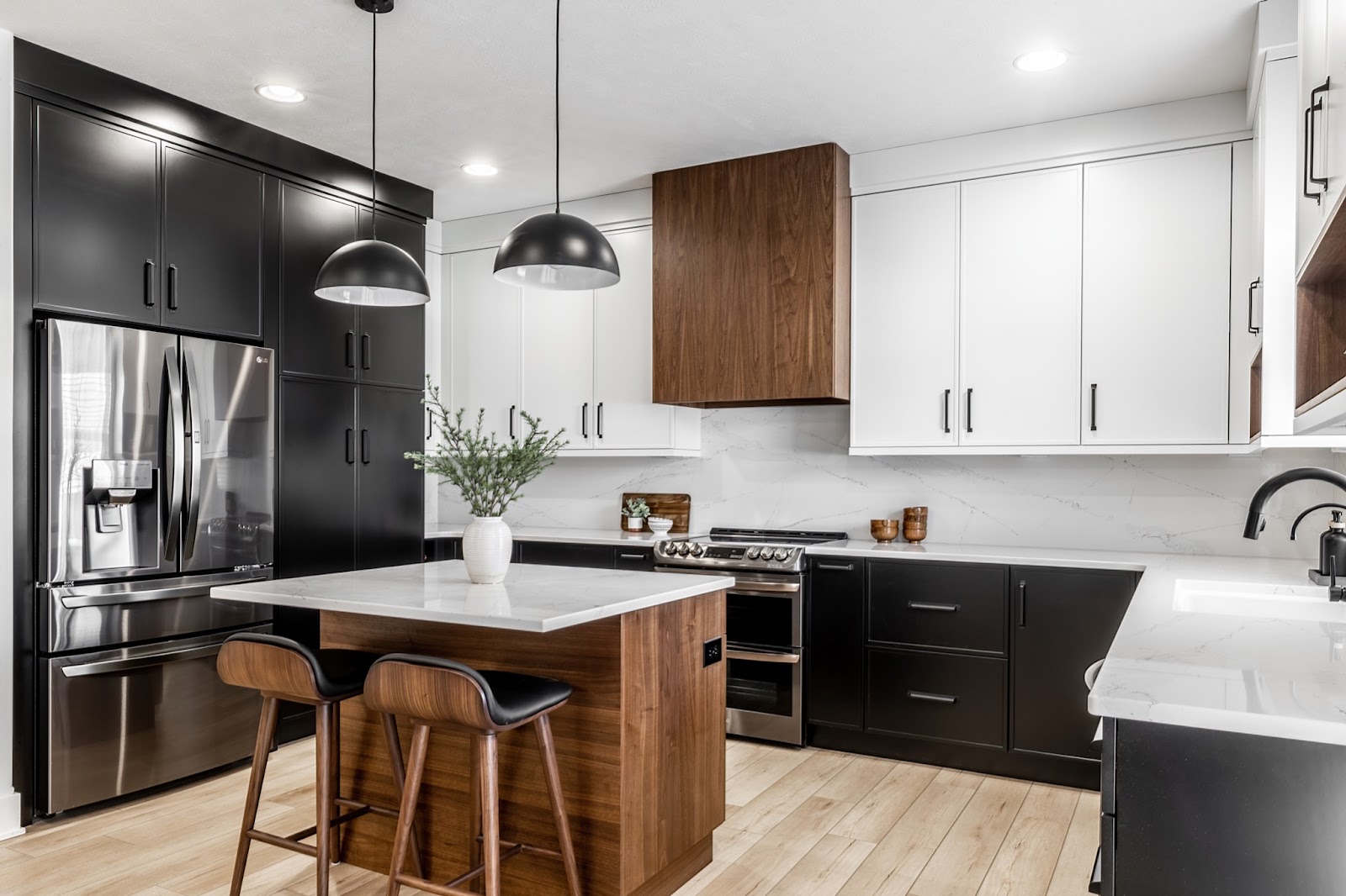 Mid-century modern kitchen design featuring neutral black and white modern cabinetry with rich wood and leather accents