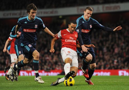 Theo Walcott in action with Robert Huth and Danny Pugh, Arsenal - Stoke City