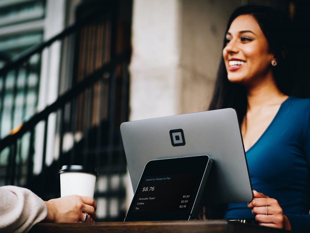 woman-laptop-while-smiling